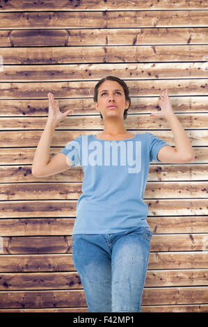 Image composite de l'ennuyé brunette gesturing Banque D'Images