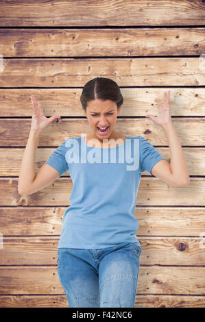 Image composite de l'ennuyé brunette gesturing Banque D'Images