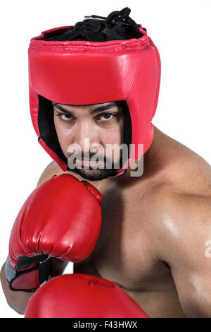 Gants de boxe dans l'homme musclé Banque D'Images