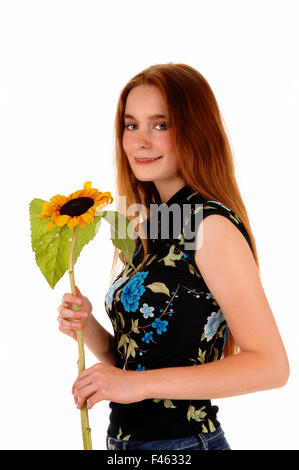 Jolie fille avec le tournesol. Banque D'Images