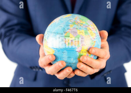 Part of businessman holding globe terrestre Banque D'Images