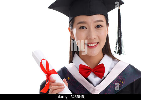 Smiling graduate holding diploma Banque D'Images