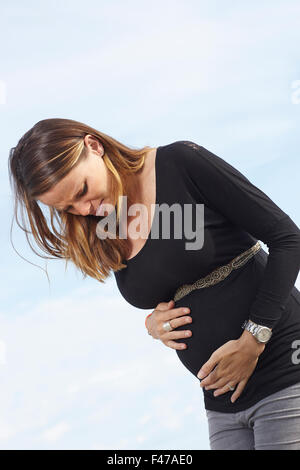 Femme enceinte, contraction Banque D'Images