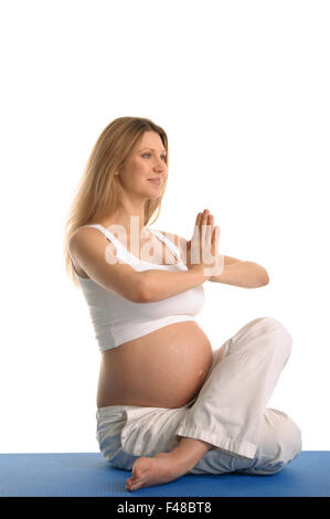 Pregnant woman sitting Banque D'Images