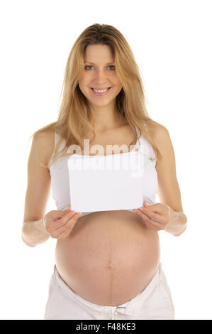 Happy pregnant woman avec un formulaire vierge Banque D'Images