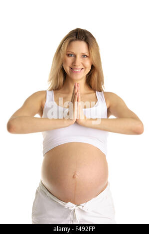 Pregnant woman practicing yoga Banque D'Images