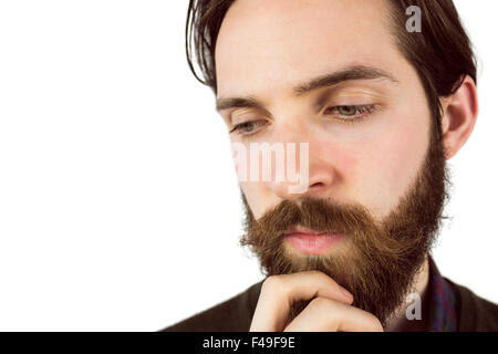 Hipster thinking with hand on chin Banque D'Images