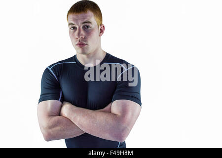 Joueur de rugby musclé avec les bras croisés Banque D'Images