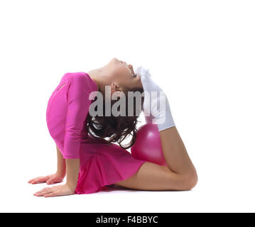 Peu flexible girl doing gymnastic ring Banque D'Images