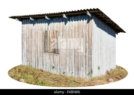 Style rustique ancien hangar a été peint en bleu. Sous l'influence du soleil et de la neige peinture écaillé et vieilli. Automne ensoleillé Banque D'Images