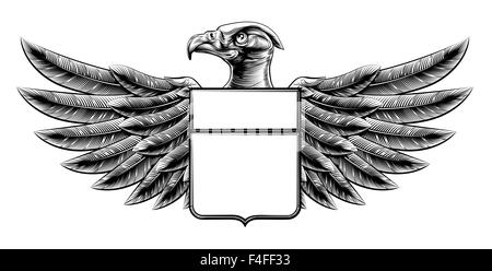 Gravure sur bois Vintage ou style bouclier ailé insigne eagle motif de défilement de bannières Banque D'Images