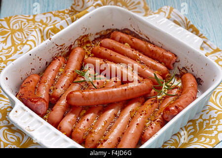 Saucisses grillées à la moutarde sauce à l'orange Banque D'Images