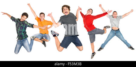 Groupe d'adolescents heureux isolé de saut en blanc Banque D'Images