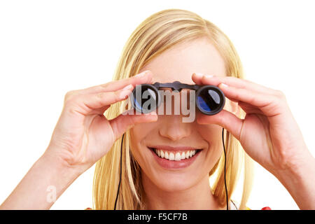 Une jeune femme heureuse binoculars Banque D'Images