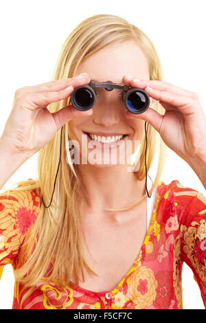 Une jeune femme heureuse binoculars Banque D'Images