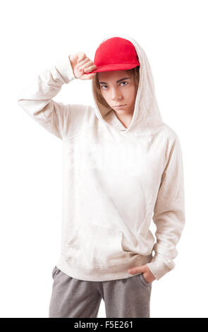 Adolescent dans un bonnet rouge et sportswear Banque D'Images