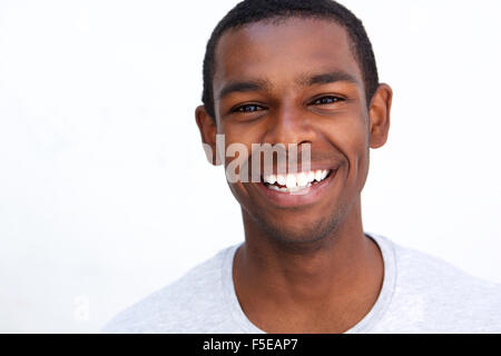 Close up portrait of a smiling african american man against white background Banque D'Images