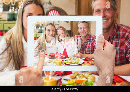 Image composite de hand holding tablet pc Banque D'Images