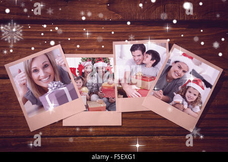 Image composite de l'heureux couple un cadeau se trouvant sur le plancher Banque D'Images