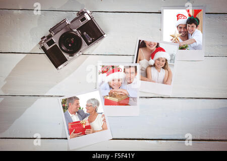 Image composite de père et fils decorating Christmas Tree Banque D'Images