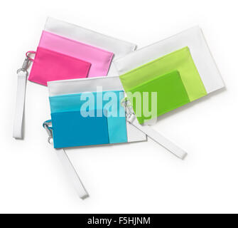 Trois pochettes en plastique féminin isolé sur fond blanc Banque D'Images