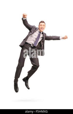 Portrait d'un homme joyeux sautant en l'air et gesticulant bonheur isolé sur fond blanc Banque D'Images