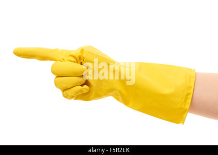 Image main de femme libre de gant en caoutchouc de protection jaune en pointant sur quelque chose contre fond blanc Banque D'Images