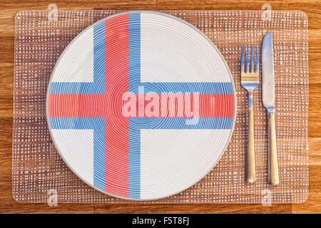 Assiette à dîner avec le drapeau de Îles Féroé sur elle pour votre nourriture et boisson des concepts. Banque D'Images