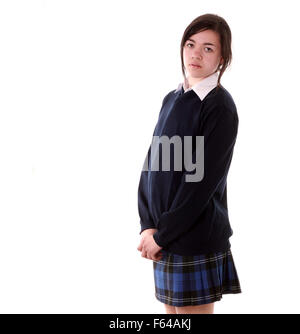 Découper isolé mixed race teenage schoolgirl dans son uniforme de l'école Banque D'Images