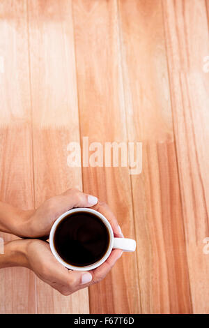 Womans mains tenant tasse de café Banque D'Images