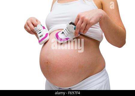 Les femmes enceintes en white lounge wear isolated on white Banque D'Images