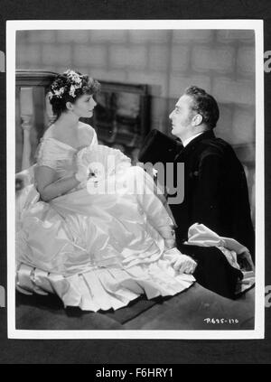 1933, le titre du film : LITTLE WOMEN, Directeur : GEORGE CUKOR, Studio : RKO, Photo : Katharine Hepburn, PAUL LUKAS, COURTISANT, robe, ventilateur. (Crédit Image : SNAP) Banque D'Images