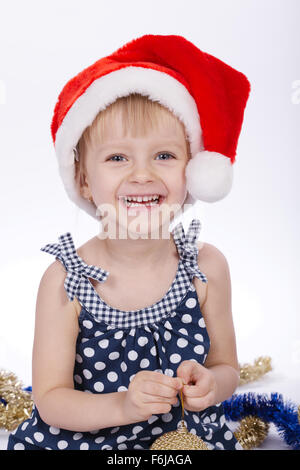 Peu de Funny Girl with santa hat Banque D'Images