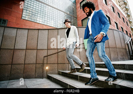 Businessmen talking on steps Banque D'Images