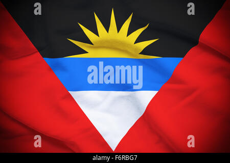 Ondulé et ridée drapeau Antigua-et-Barbuda l'arrière-plan. Banque D'Images