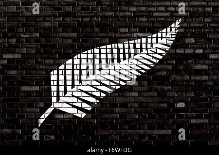 Pavillon de Silver Fern peint sur mur de brique Banque D'Images