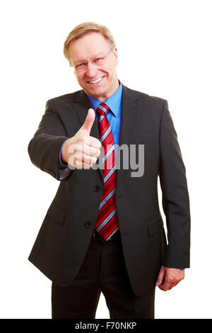 Senior businessman in a suit en tenant son pouce vers le haut Banque D'Images