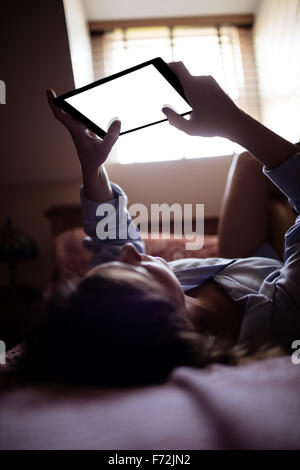 Young woman using tablet