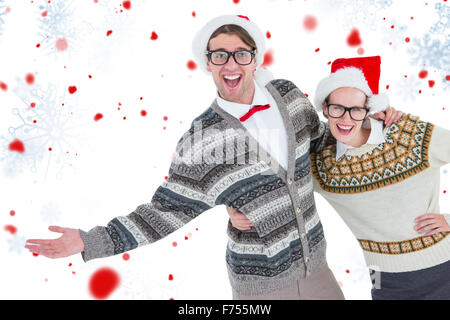 Image composite de portrait of smiling woman with hand on hip avec l'homme Banque D'Images