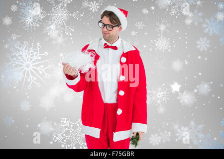 Image composite de hipster geek en costume père noël à la barbe à Banque D'Images