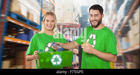 Composite image of happy man holding bottle Banque D'Images