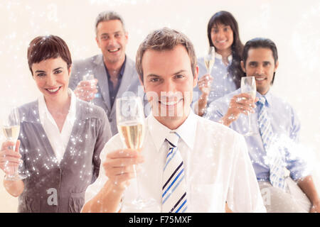 Image composite de international business people toasting with champagne Banque D'Images
