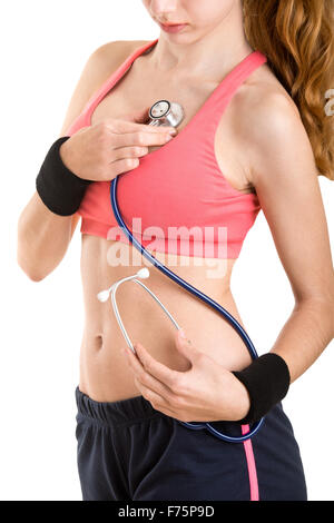 Concept d'une femme sportive l'examen de sa santé Banque D'Images