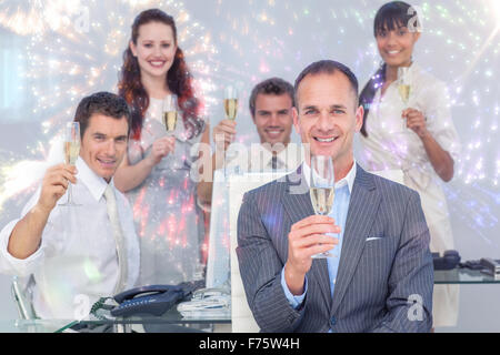 Image composite de collègues toasting with champagne Banque D'Images