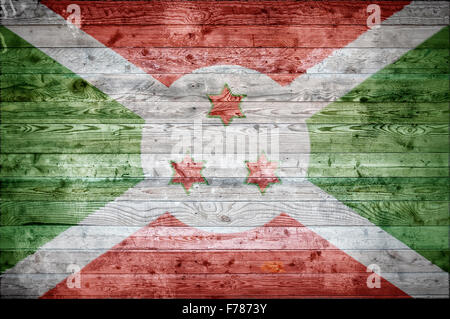 Une vignetted image de fond du drapeau du Burundi peints sur des planches de bois d'un mur ou le plancher. Banque D'Images