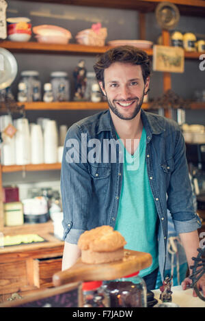 Propriétaire d'une boutique de café Banque D'Images