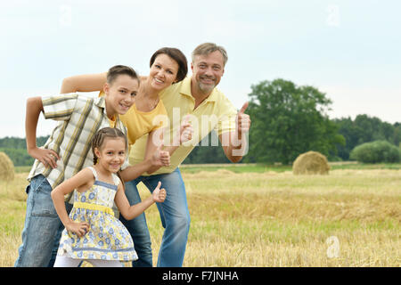 Happy family with Thumbs up Banque D'Images