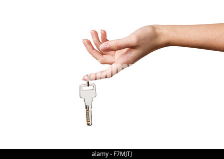 Belle femme part avec une clé isolé sur fond blanc Banque D'Images