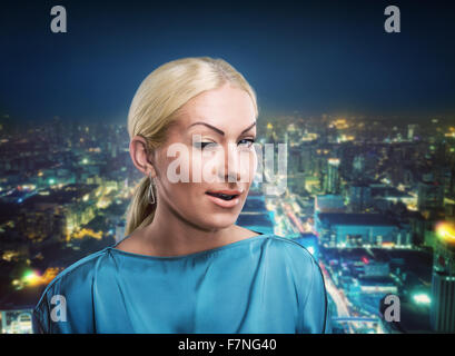 Businesswoman winking Banque D'Images