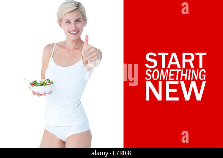 Image composite de la belle fit woman holding a Bowl of salad with Thumbs up Banque D'Images